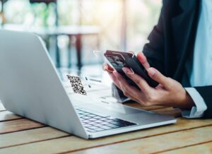 businessman scanning qr code on laptop